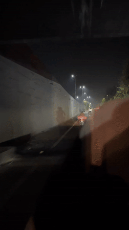 Evening traffic flows normally through Lahore roads and underpass