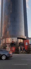 Outside a Tashkent KFC at the base of a glass tower