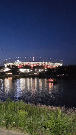 Warsaw's Vistula riverfront glows on a summer evening