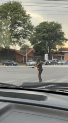 Street performer juggles fire in Puebla intersection