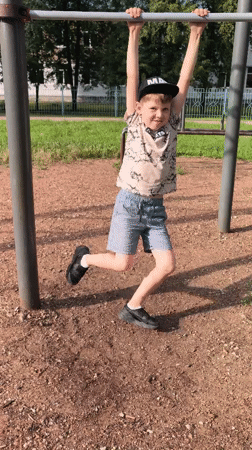 Summer afternoon in a Sterlitamak park: kids, flowers, and city landmarks