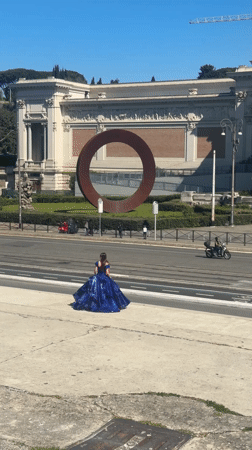 Woman in blue gown spotted near grand Roman building