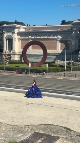 Woman in blue gown spotted near grand Roman building