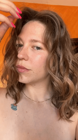 Woman takes mirror selfies in Podgorica room