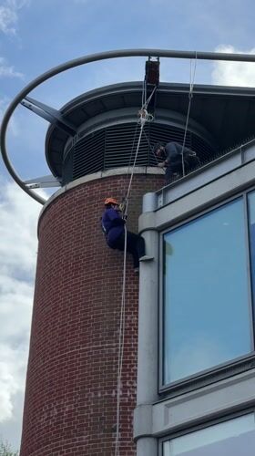 Norwich city scenes documented including cathedral, memorial, abseiling activity