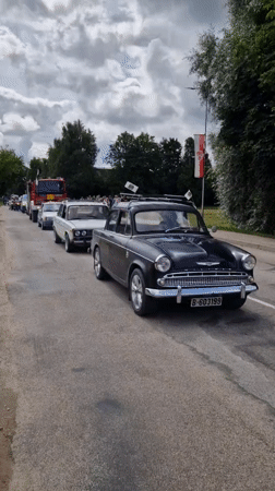 Classic cars, military vehicles, and crowd scenes in Priekule, Latvia