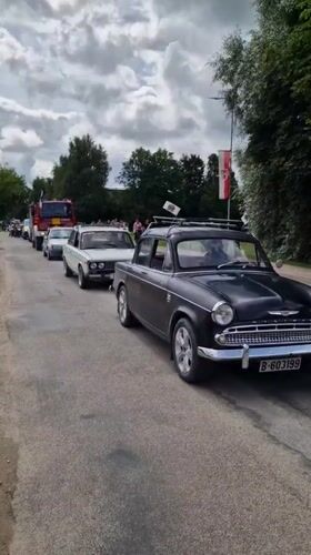 Classic cars, military vehicles, and crowd scenes in Priekule, Latvia