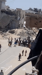 Water distribution draws crowds in damaged Khan Yunis neighborhood