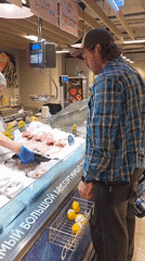 Man shops for seafood at Saint Petersburg supermarket