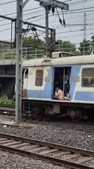 Mumbai's Western Railway locals, doors open, passengers in transit