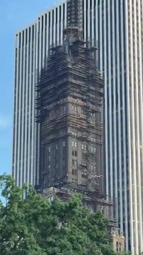 Art, trees, and scaffolded skyline near Central Park