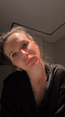Woman takes selfies indoors in Khimki, Russia