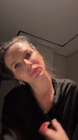 Woman takes selfies indoors in Khimki, Russia
