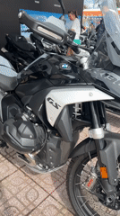 Motorcycle exhibition displays custom BMWs, Harleys in urban gathering