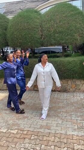 Women pose in matching pajamas for photo shoot Nigeria