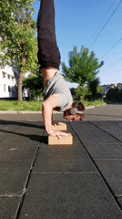 Street performer executes handstand routine in Burgas, Bulgaria