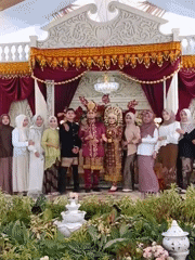 Wedding celebration documented with ornate stage decorations
