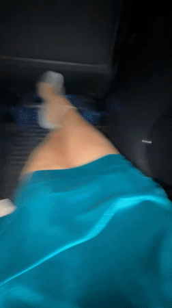 Late-night car ride through Moscow, teal dress, red light
