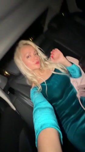 Late-night car ride through Moscow, teal dress, red light
