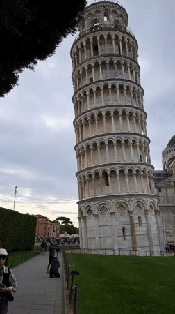 Tourist captures standard view of Leaning Tower of Pisa