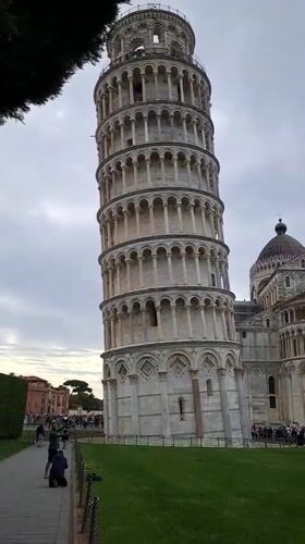 Tourist captures standard view of Leaning Tower of Pisa