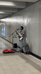 Electric guitar busking on a Montreal pedestrian walkway