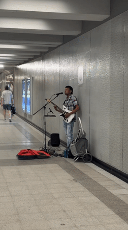 Electric guitar busking on a Montreal pedestrian walkway