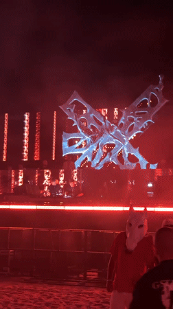 Glowing sculpture over a red-lit DJ stage in Nesebar