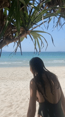 Beach day on a calm Vietnamese coastline, green swimsuit and selfies