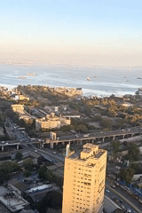 Domestic life documented in Mumbai high-rise apartment overlooking coastline
