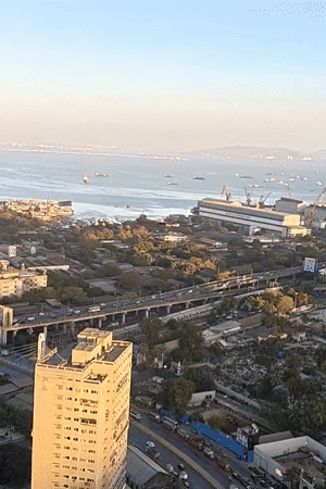 Domestic life documented in Mumbai high-rise apartment overlooking coastline