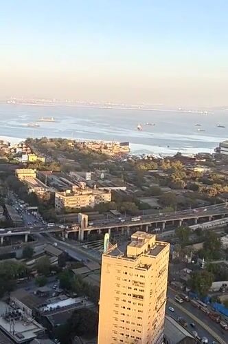 Domestic life documented in Mumbai high-rise apartment overlooking coastline