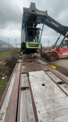 Combine harvester loaded onto railcar in Bulgarian town