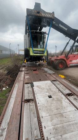Combine harvester loaded onto railcar in Bulgarian town
