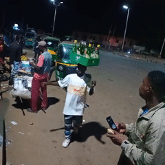 Nighttime street life documented in Bukuru, Nigeria marketplace district