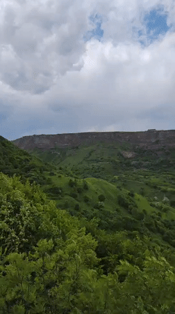 Tourist documents Armenian valley monasteries and landscapes near Kurtan
