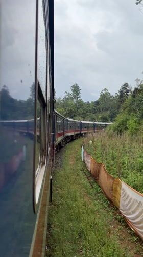 Train travels curved track in Heeloya, Sri Lanka