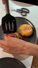 Copenhagen resident cooks homemade burgers with sautéed onions