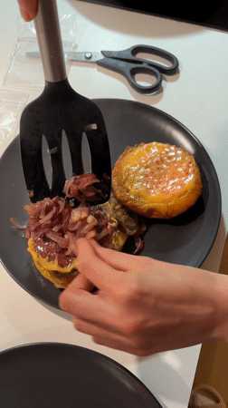 Copenhagen resident cooks homemade burgers with sautéed onions
