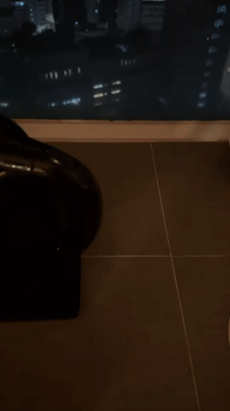 Night cityscape filmed through window in Hong Kong