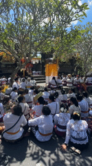 Large group gathers at decorated structure in North Kuta