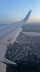 Airplane passenger captures dusk aerial view of Perm, Russia