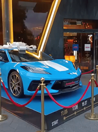 Blue Corvette with bow on display platform in Tallinn