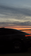 Riga skyline glows in orange and pink at sunset