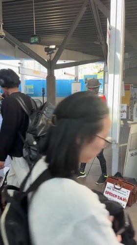 Spider-Man street performer entertains at Burnaby SkyTrain station