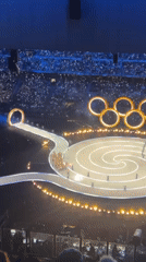 Olympic ceremony with spiral stage captured in Milan stadium