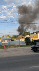 Heavy black smoke rises over residential area in Qoyankus