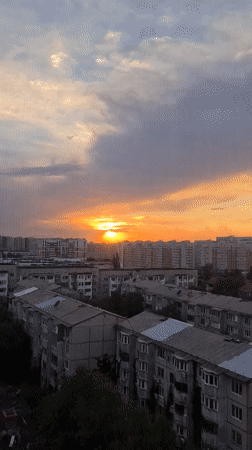 Almaty sunset breaks through storm clouds in vivid color