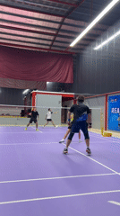 Doubles badminton match observed at Ko Samui sports facility