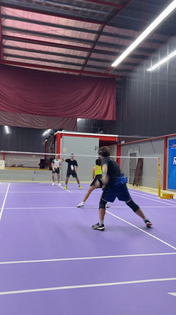 Doubles badminton match observed at Ko Samui sports facility
